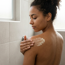 Load image into Gallery viewer, Gen Z adult applying body scrub to her shoulder